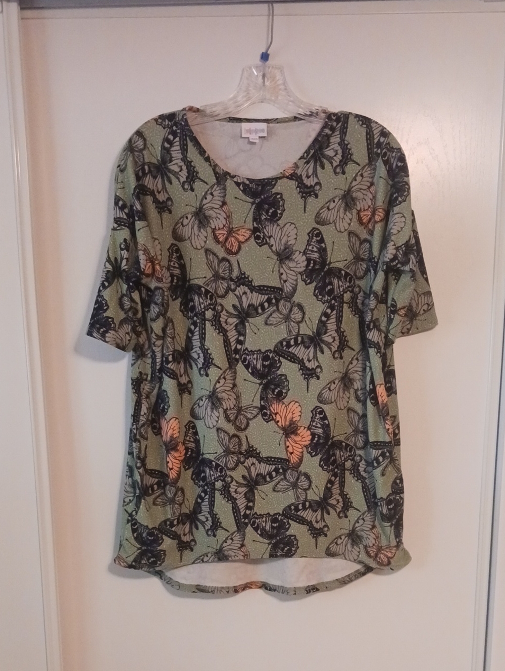 LuLaRoe Green Butterfly Print Short Sleeve Top with Peach Accents